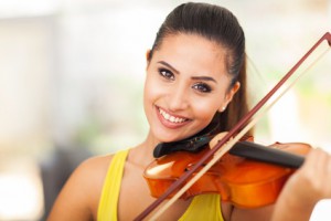beautiful female musician playing violin